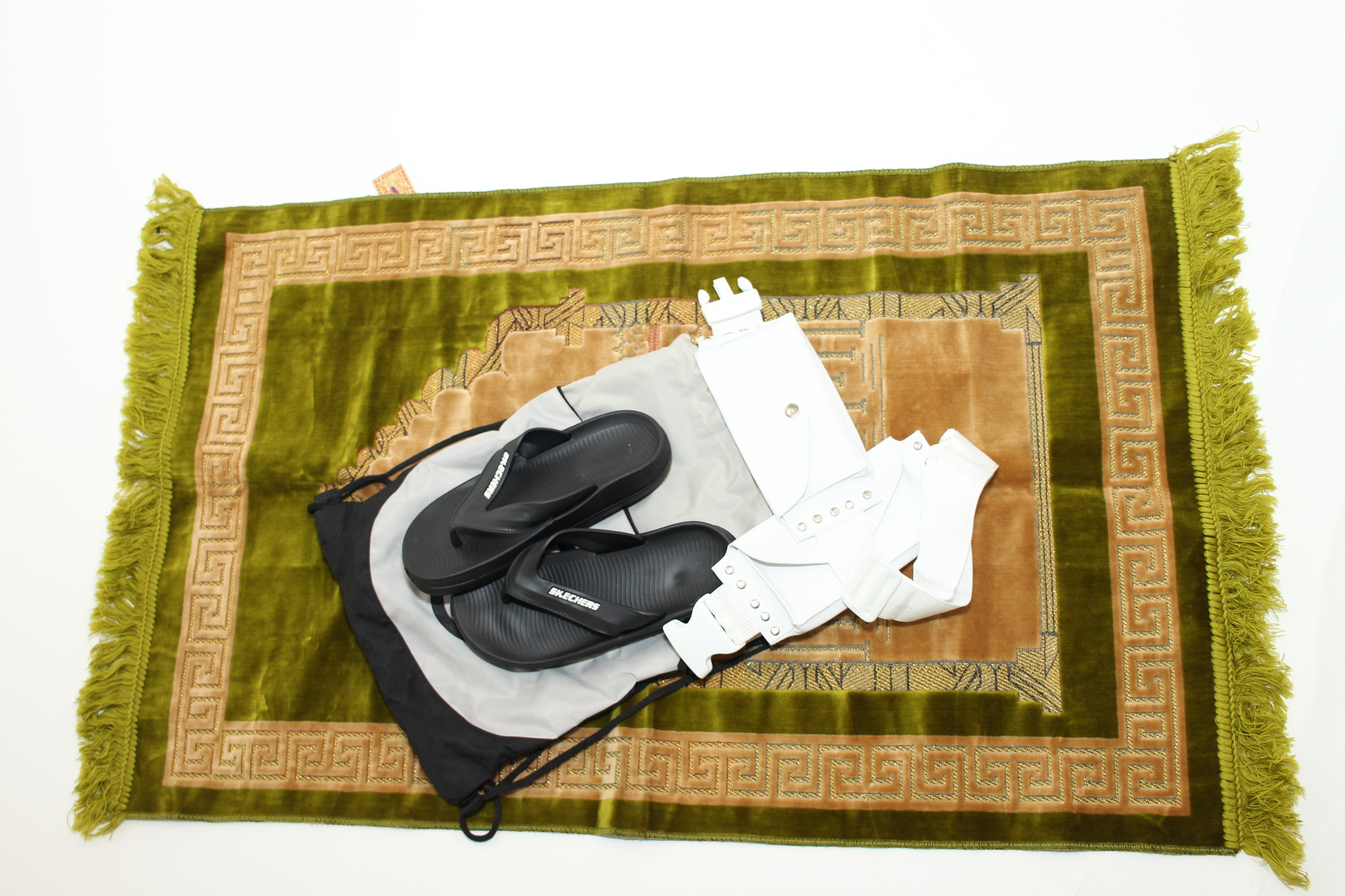 The Ihram Kit on prayer rug